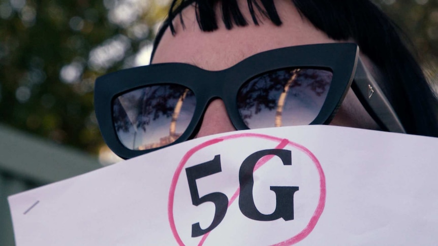 A protester at a recent rally against the 5G rollout.