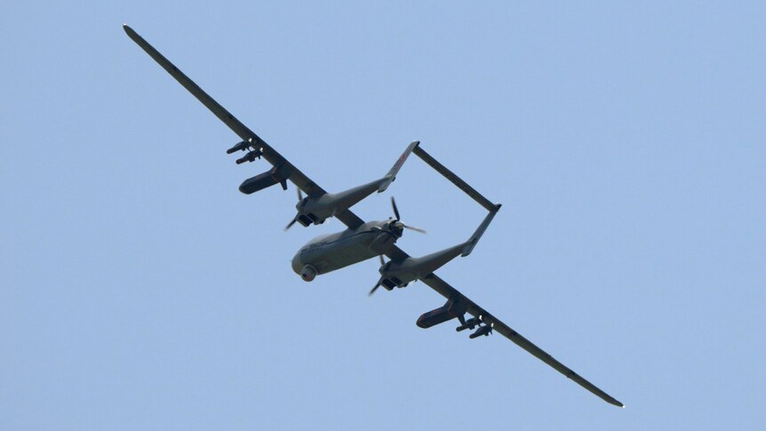 A TB-001 twin-tailed scorpion drone is seen flying in the air.