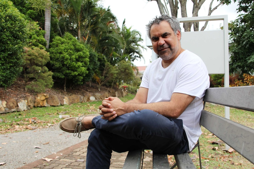 Actor and director Wayne Blair sits on a bench at Central Queensland University in Rockhampton.