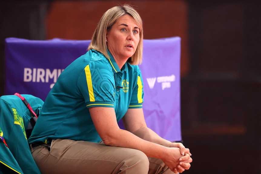 Australian netball coach Stacey Marinkovich sits on the bench during the Diamonds' Commonwealth Games gold medal match.
