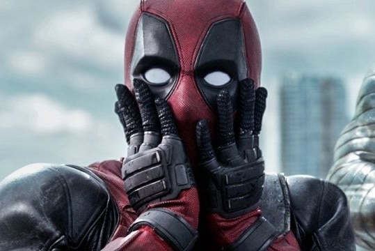 image of ryan reynolds as deadpool hands over his mouth in shock