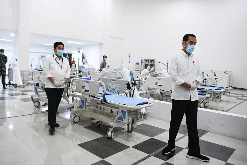 Indonesian President Joko Widodo inspects medical equipment at a new hospital in Jakarta.