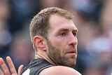 Travis Cloke of the Magpies is congratulated by Travis Varcoe