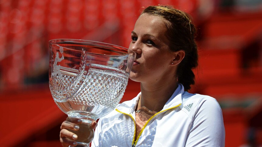 Spoils of victory ... Anastasia Pavlyuchenkova Russia kisses the tournament trophy