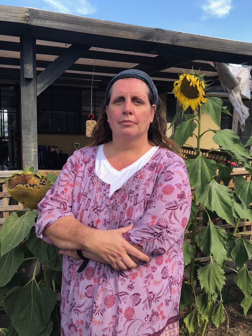 Fiona standing in front of sunflowers, 3rd March 2019