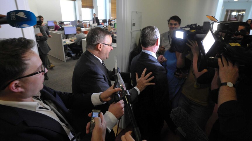 Anthony Albanese uses Christopher Pyne as a shield.