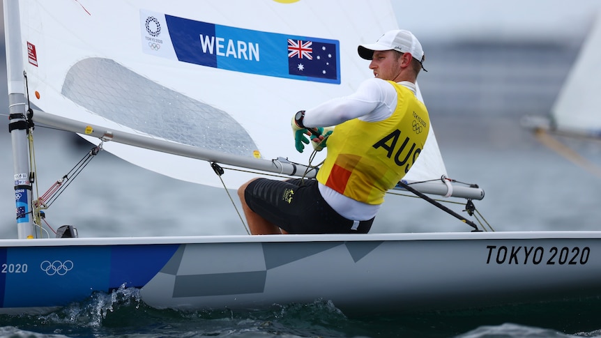 An Australian male sailor competing in the laser class at the Tokyo Olympics.