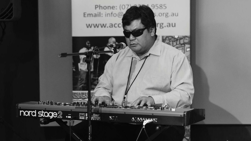 David Truong plays the keyboard