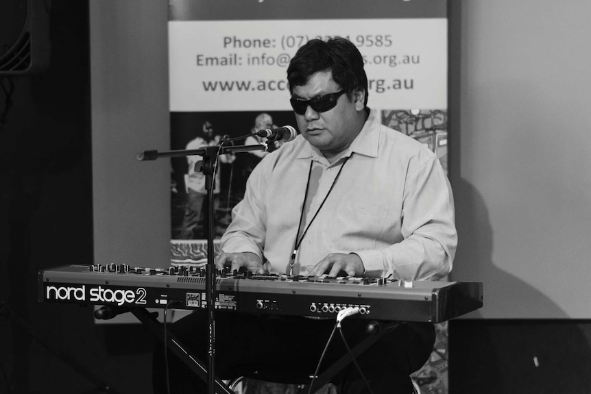 David Truong plays the keyboard