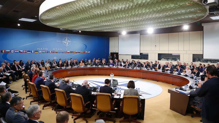NATO Secretary General Jens Stoltenberg addresses the NATO defence meeting.