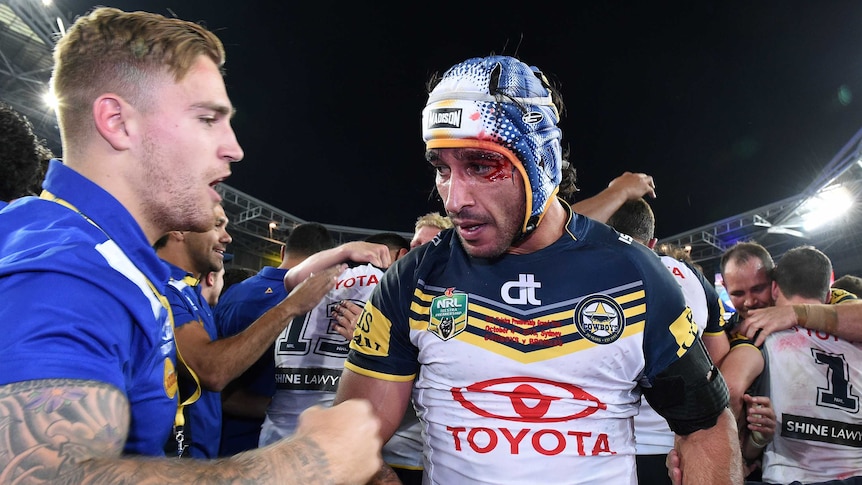 North Queensland's Johnathan Thurston celebrates victory in the NRL Grand Final over Brisbane.