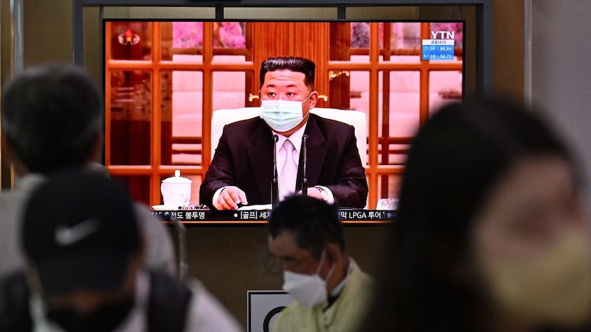 North Koreas leader Kim Jong Un appearing on TV wearing a face mask