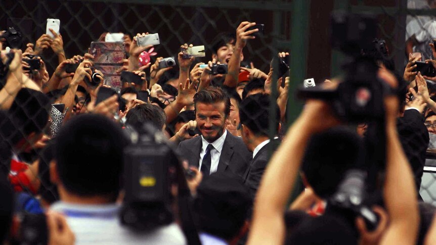 Beckham experiences the crush in China