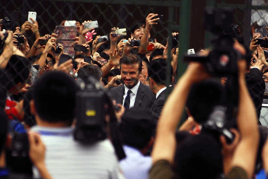 Beckham experiences the crush in China