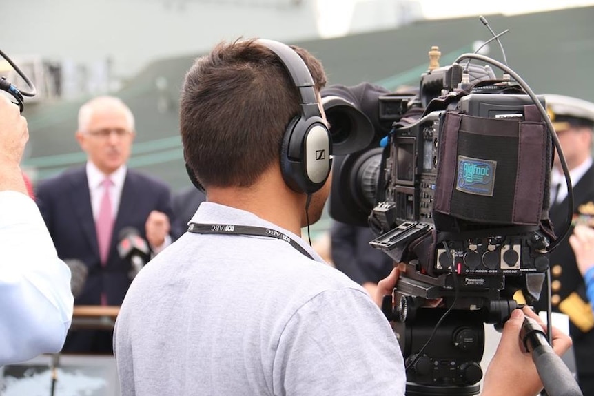 Rear shot of Haidarr Jones filming Prime Minister Malcolm Turnbull.