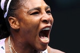 Serena Williams screams and pumps her fist