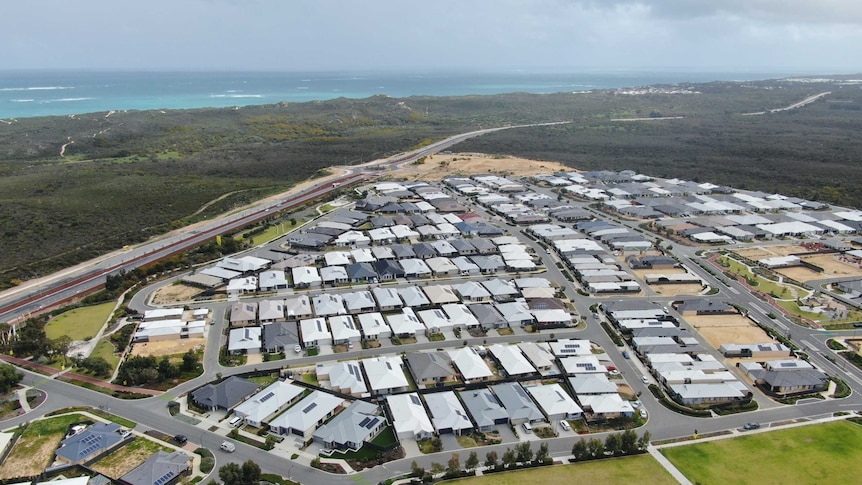An aerial shot of a coastal housing development in Perth