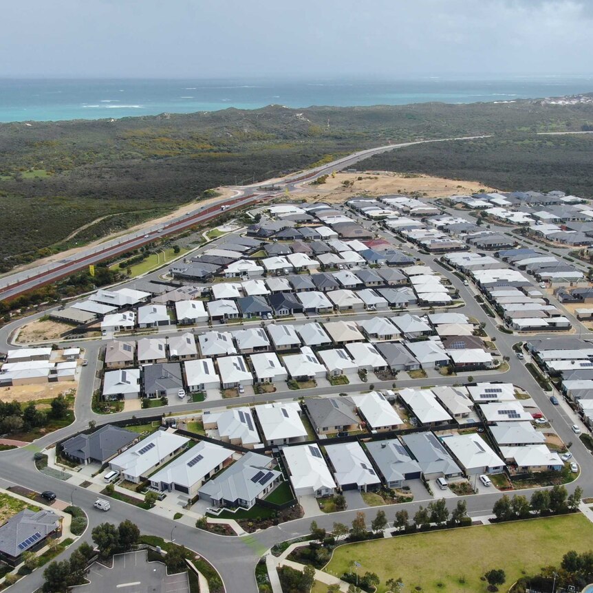 An aerial shot of a coastal housing development in Perth