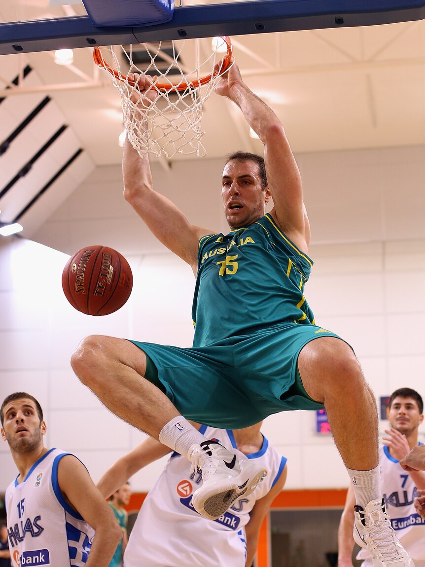 Throwing down ... Aleks Maric dunks on the Greek defence.