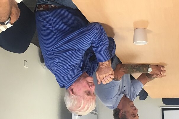 Two men at a meeting of black lung victims