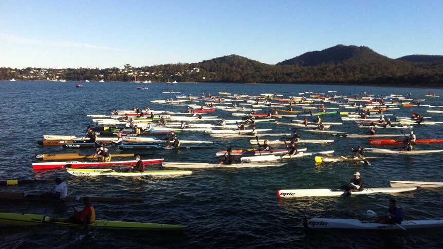 Kayakers take to the water in the Freycinet Challenge on Tasmania's east coast.