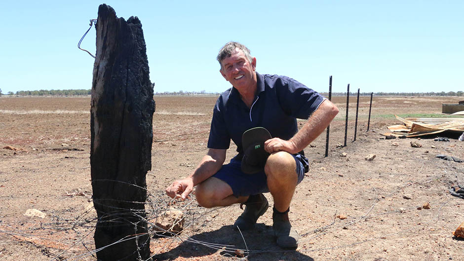 Malcolm Hayes inspects the fire-ravaged fencing on his Cookernup property.