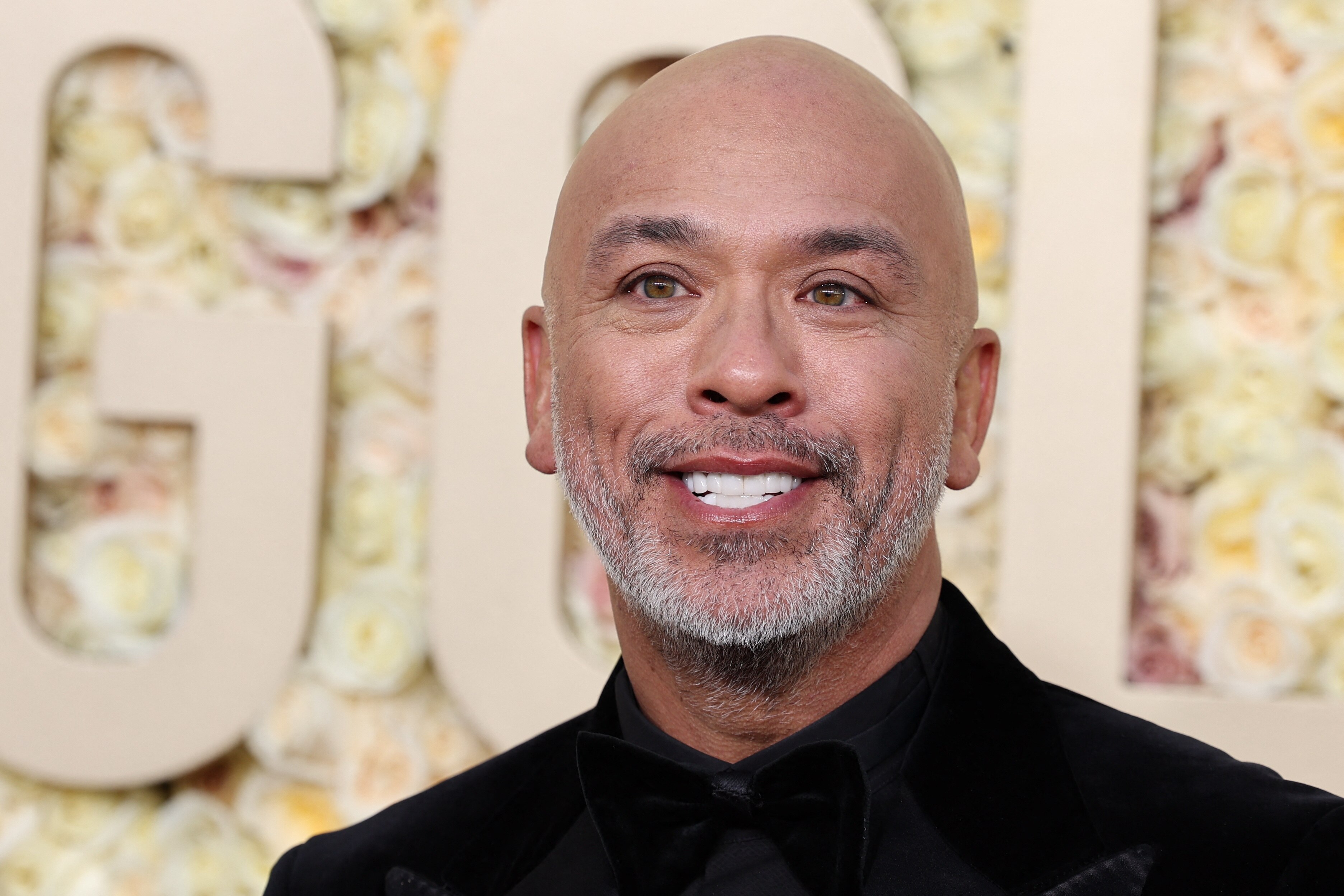Jo Koy smiling, headshot, at the Golden Globes
