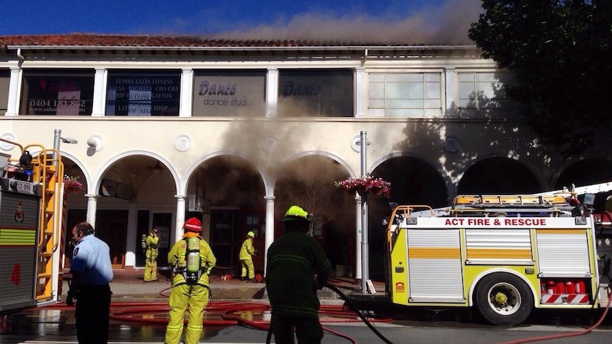 Emergency services begin to battle the fire in a restaurant in the Sydney Building.