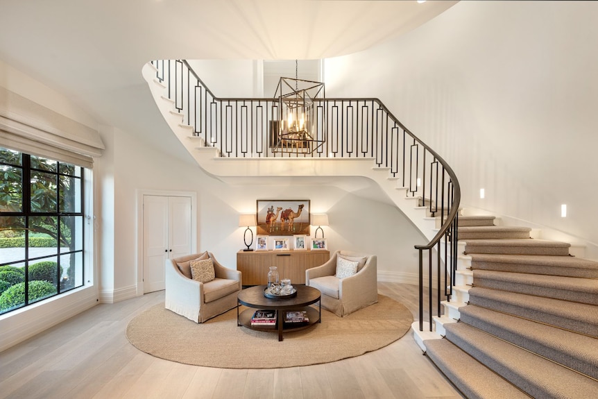 A sitting area with a spiral staircase.