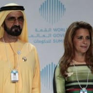Sheikh Mohammed wearing traditional clothes standing with his wife Princess Haya  in a dress at World Government Summit