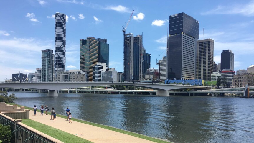 People walking by the Brisbane River at South Bank