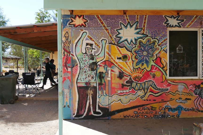 colourful mural on the side of a community centre at Karnte Camp, Alice Springs 