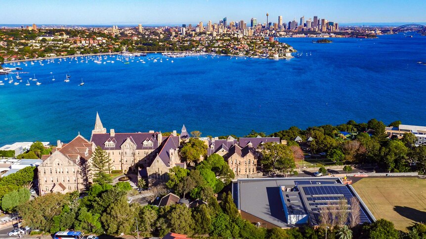 A wide view over Kincoppal Rose Bay showing solar panels on the fitness centre