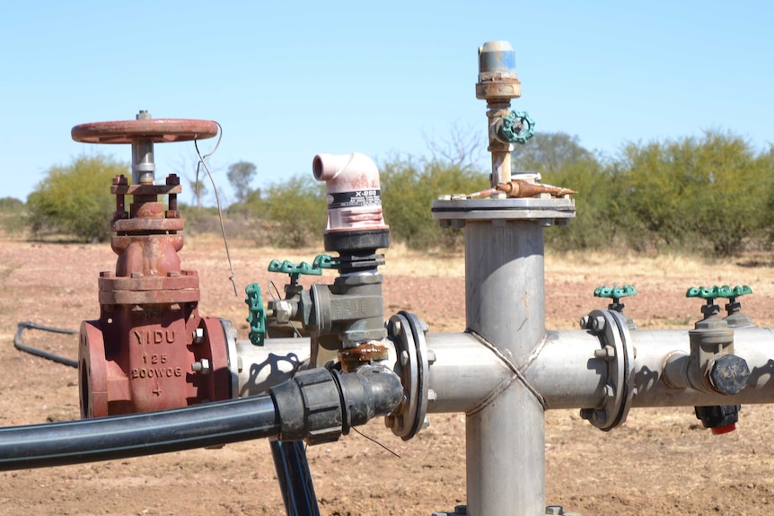 A pump and tap on a capped bore in western Queensland.