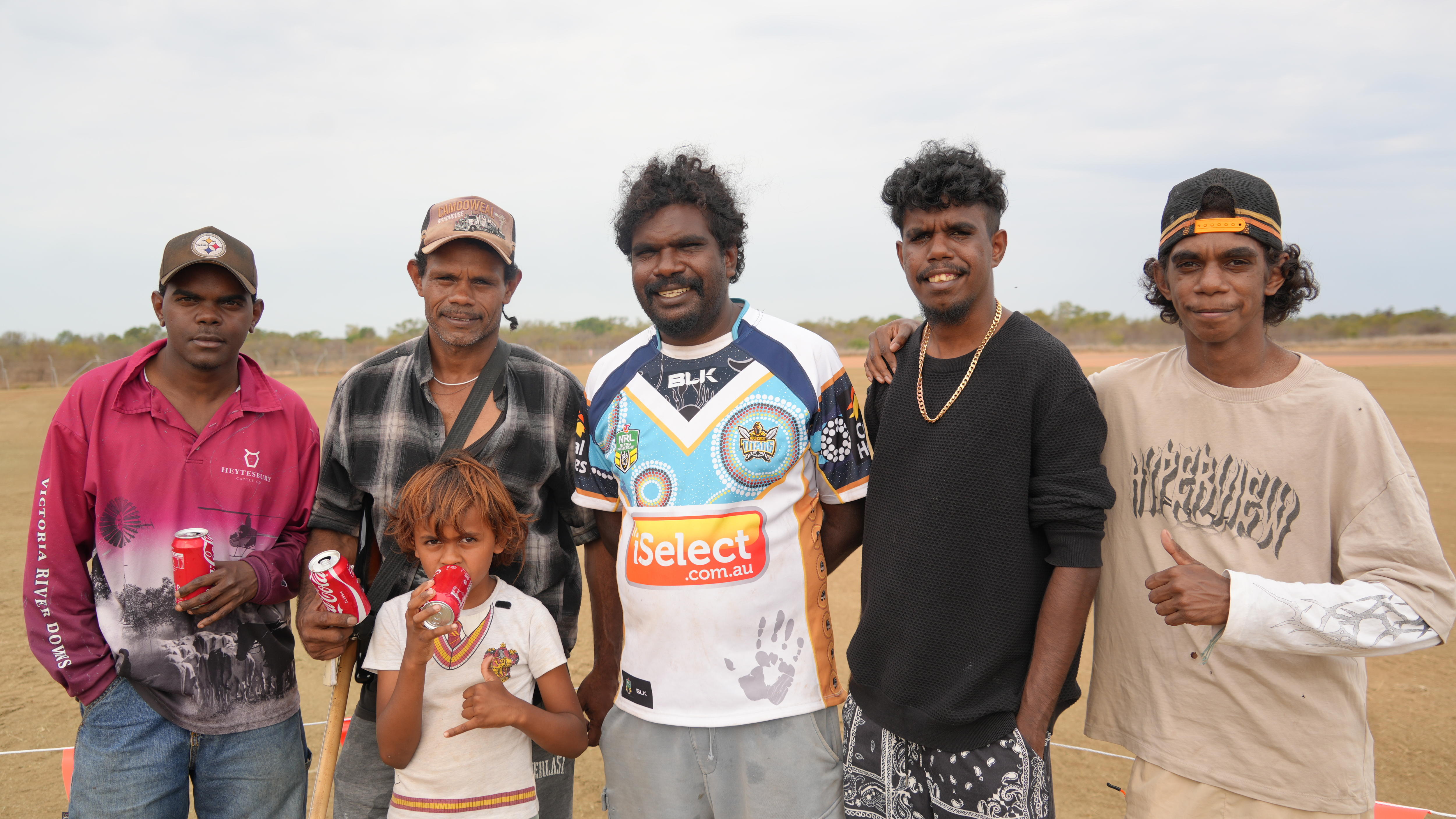 Group of musicians posing for a photo at Burektown airstrip