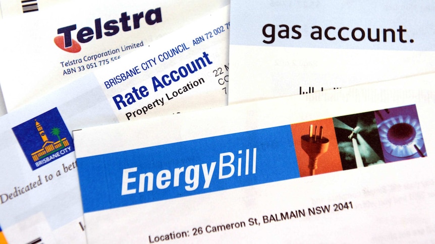 A variety of utilities bills scattered on a desk