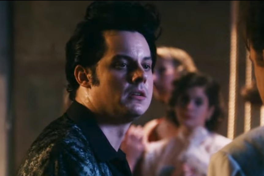 Jack White looks disgusted, staring at John C. Reilly as Dewey Cox.