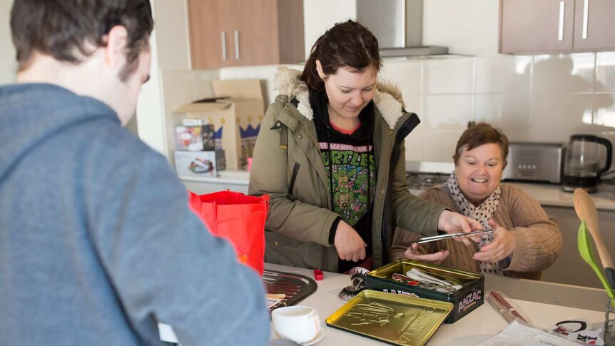 Nicki's mum helps the couple unpack in the kitchen of their home.