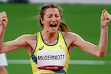 An Australian female high jumper screams out in joy after clearing a height in the women's Olympic final.