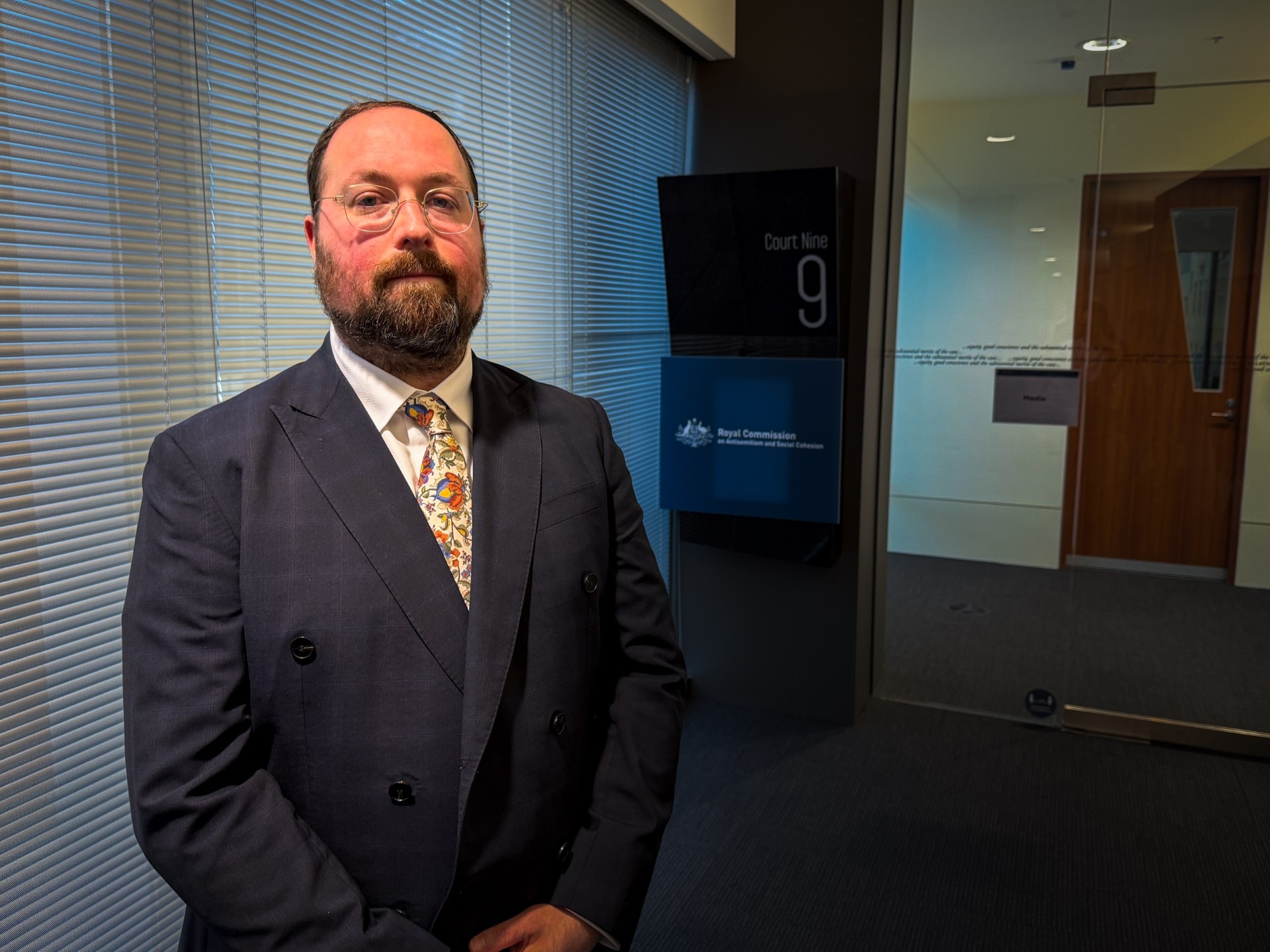 Live: Board member of firebombed synagogue gives emotional evidence to royal commission