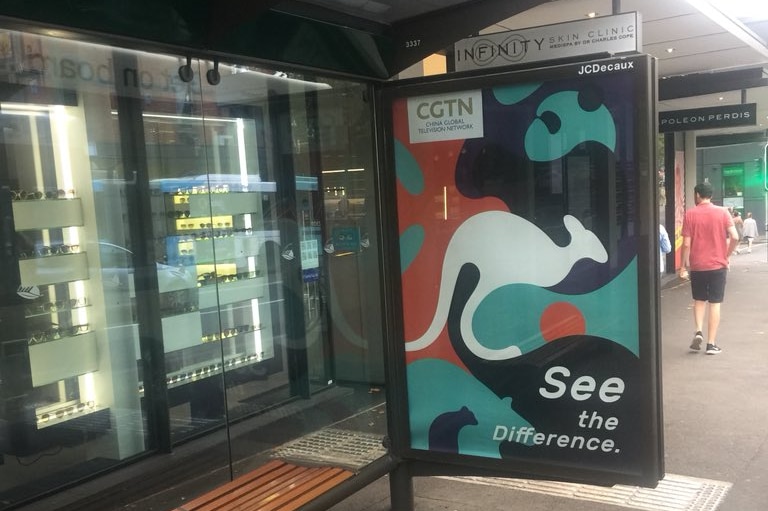 A billboard adorned with a kangaroo and panda.