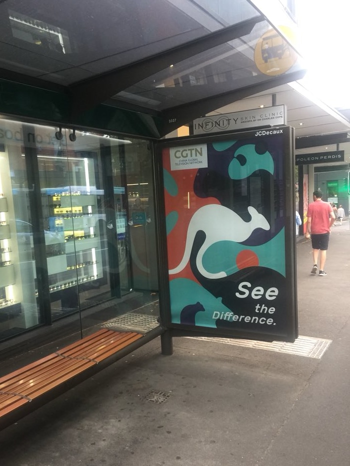 A billboard adorned with a kangaroo and panda.