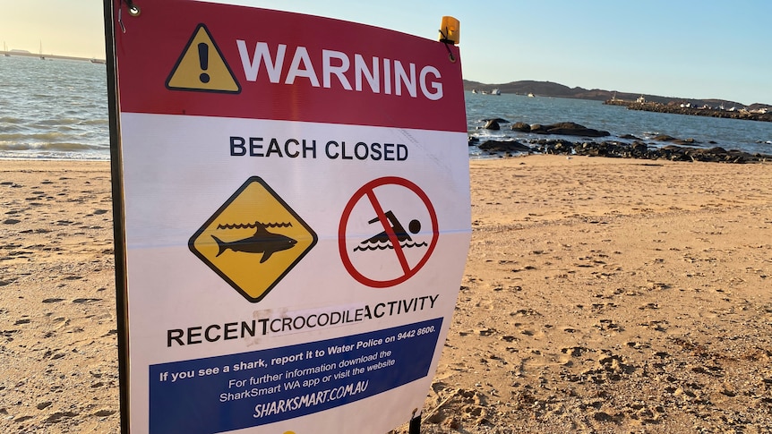 Sign reads 'Beach Closed'