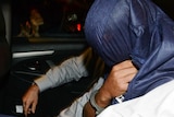 Man arrives at the police Watch House in Brisbane, Tuesday, April 8, 2014.