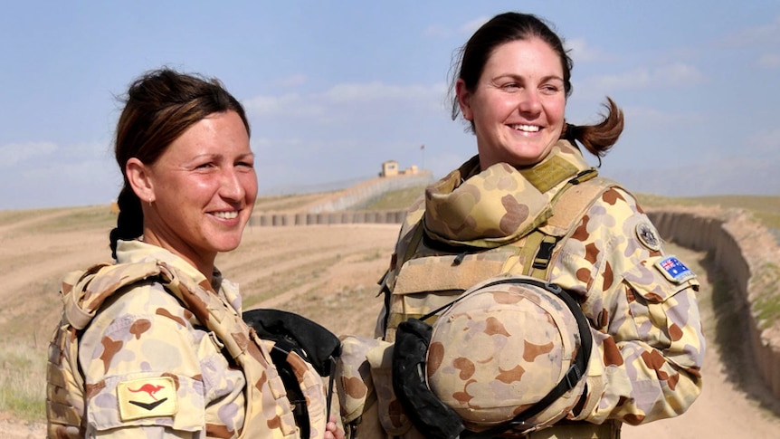 Corporals Ivona Bartush and Nicole Spohn serving in Afghanistan.