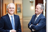 PM Malcolm Turnbull and Opposition Leader Bill Shorten chat in the hallway of Parliament House