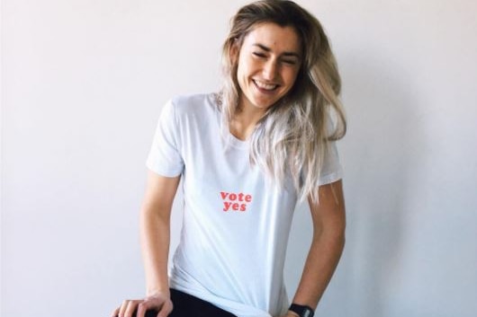 Francess Abbott wears a white Vote Yes T-shirt.