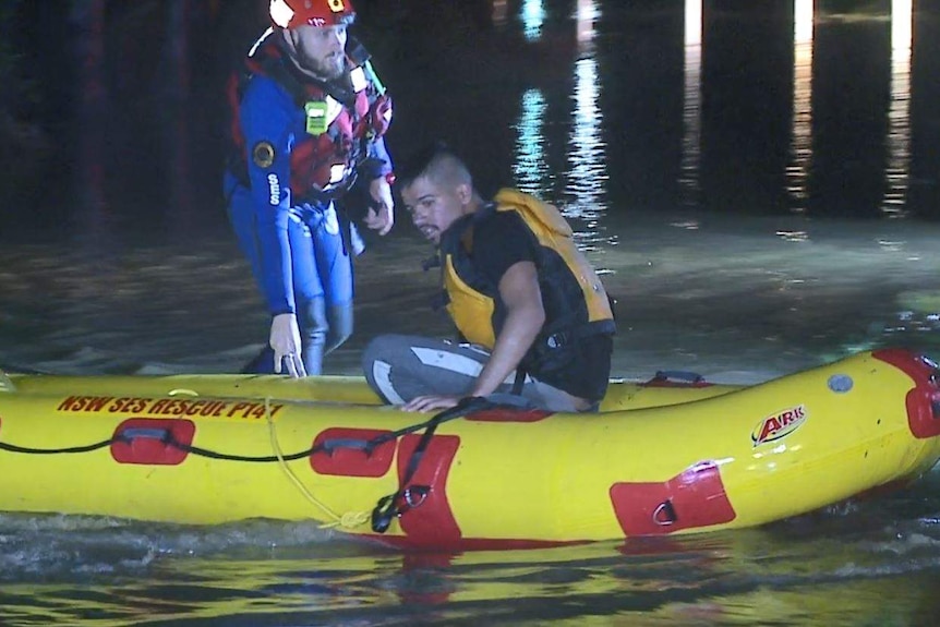 Man in inflatable SES boat.