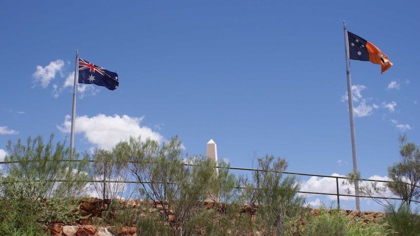 Two flags fly at Anzac Hill in Alice Springs.