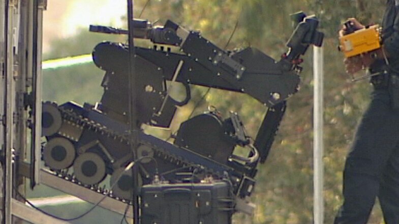 Police used sophisticated equipment to inspect the package outside the childcare centre.